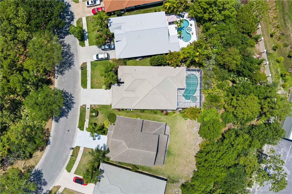 7221 Southeast Seagate Lane Stuart, FL 34997 - Photo 40 of 51 an aerial view of house with a yard