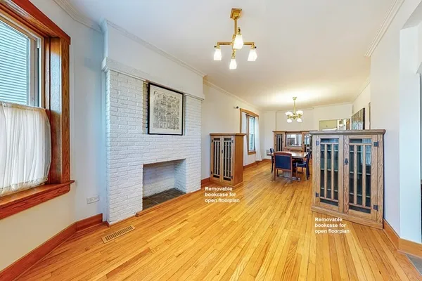 a view of a livingroom with furniture wooden floor and window