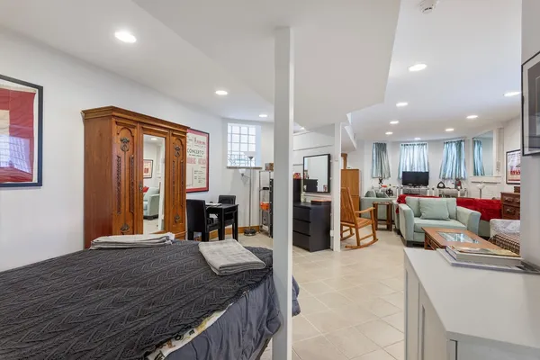 a living room with a couch and a window