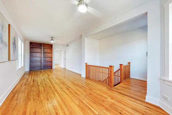 a view of a room with wooden floor and closet