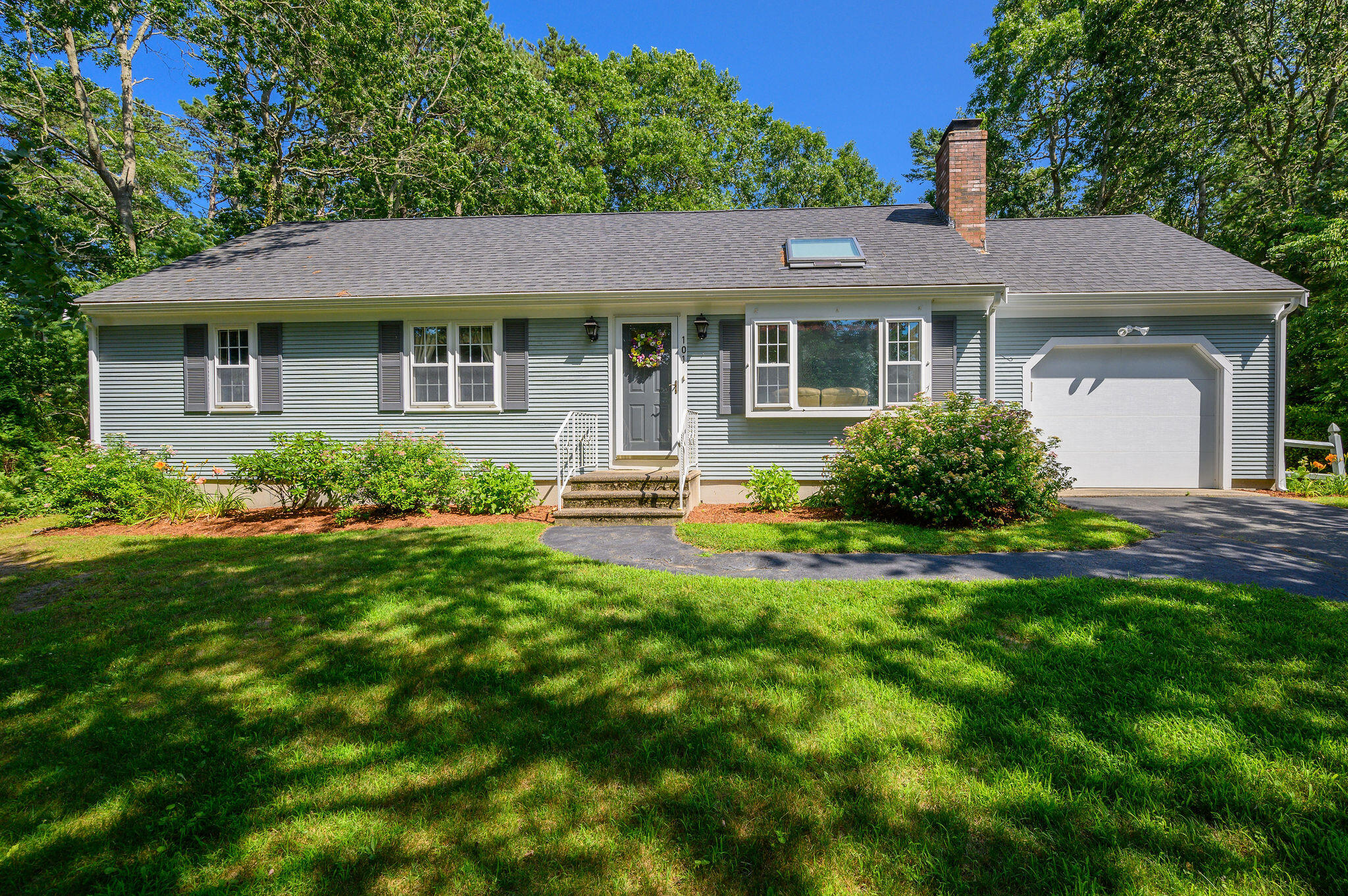 a front view of a house with swimming pool