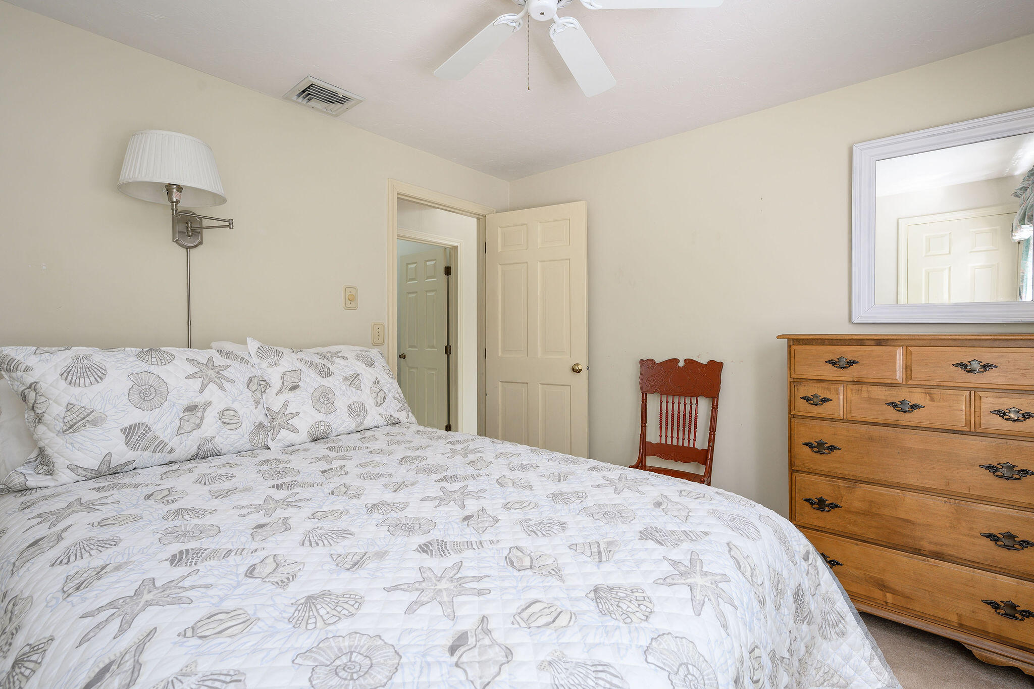 101 Oldham Road Osterville, MA 02655 - Photo 15 of 32 a bedroom with a bed and a dresser