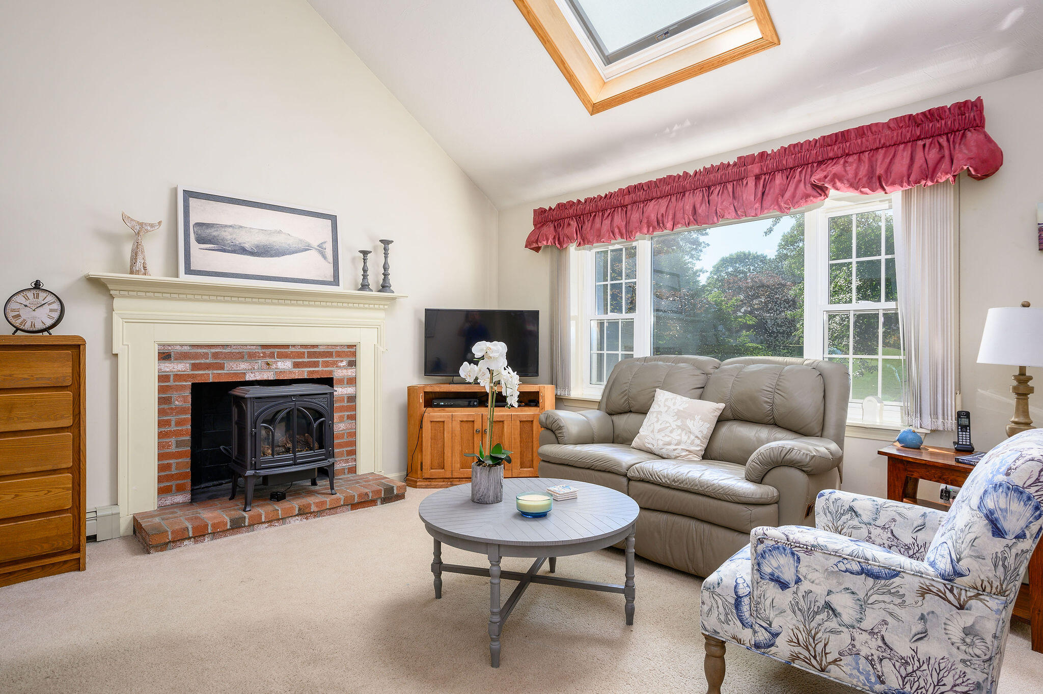 101 Oldham Road Osterville, MA 02655 - Photo 5 of 32 a living room with furniture a fireplace and a large window
