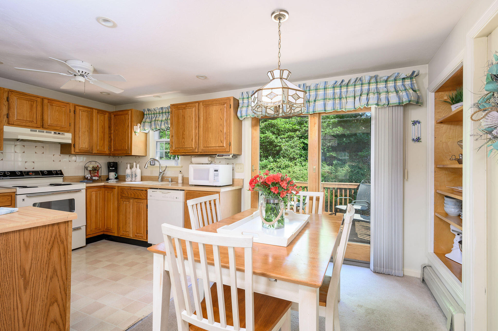 101 Oldham Road Osterville, MA 02655 - Photo 7 of 32 a kitchen with kitchen island a large counter top space appliances and a center island