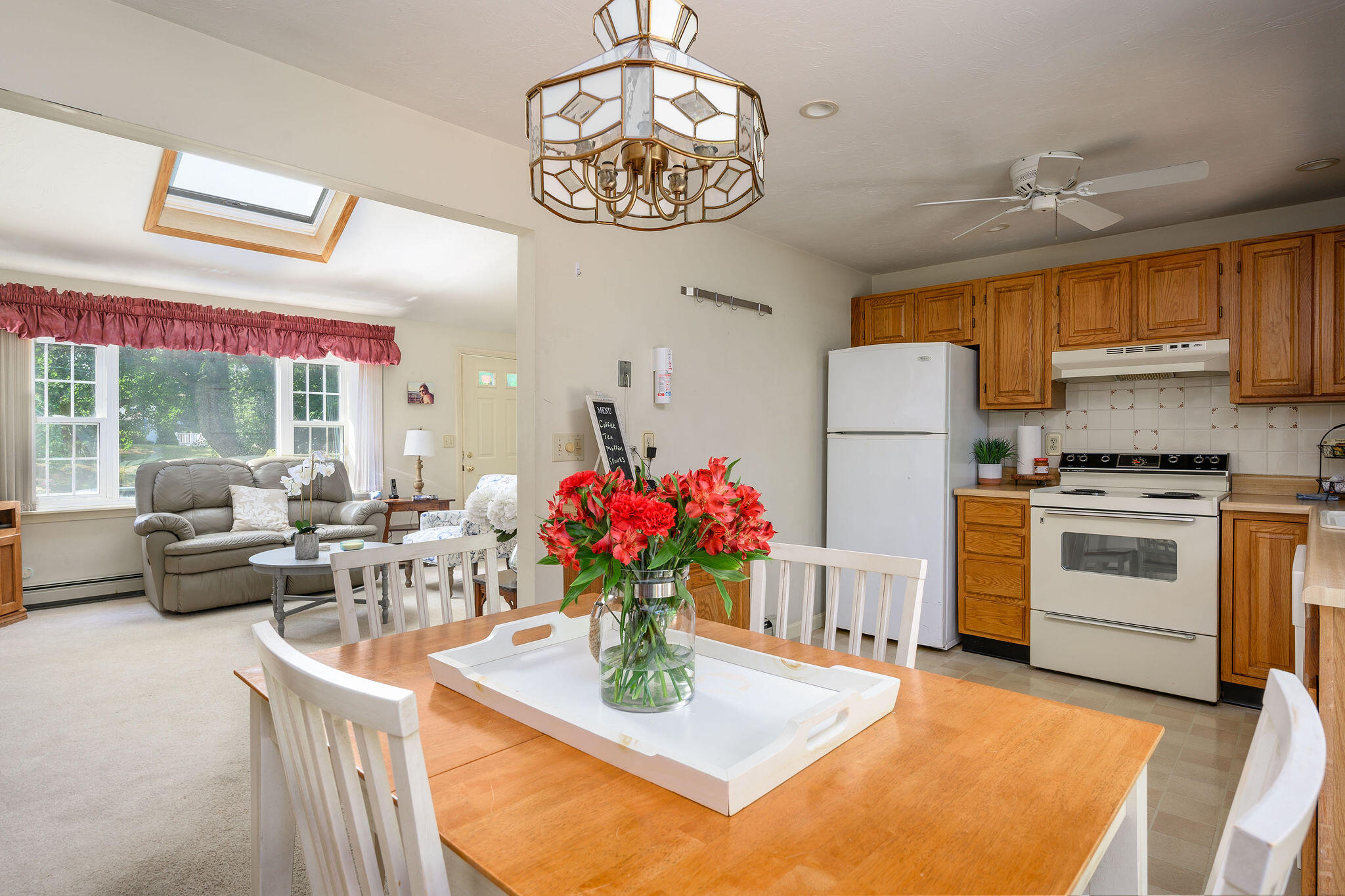 101 Oldham Road Osterville, MA 02655 - Photo 8 of 32 a kitchen with stainless steel appliances kitchen island granite countertop a stove a refrigerator and a view of living room