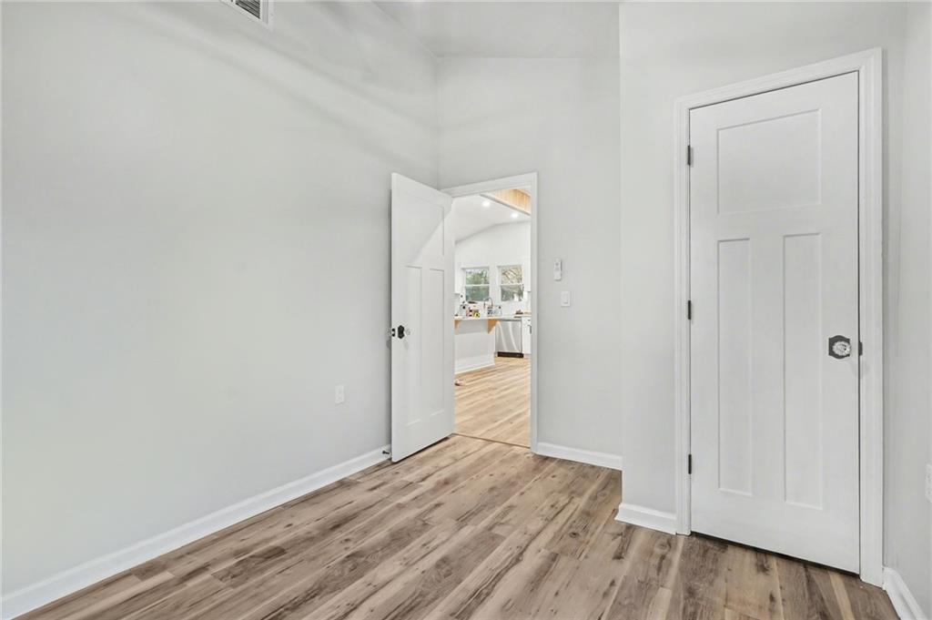 1004 Mapp Street Madison, GA 30650 - Photo 11 of 30 a view of an empty room with wooden floor