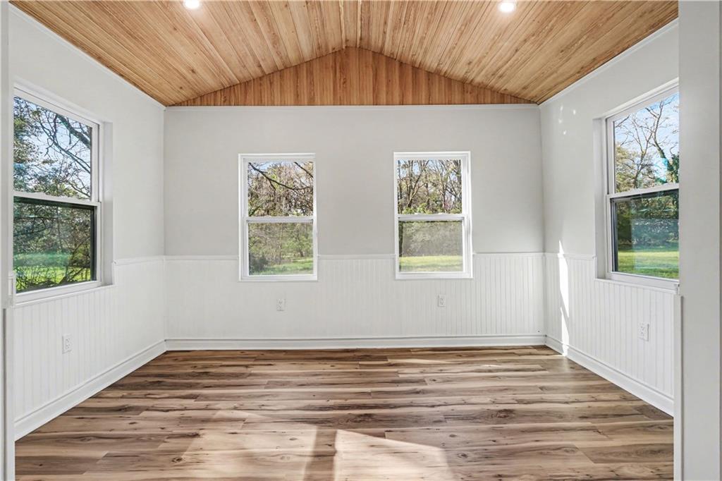 1004 Mapp Street Madison, GA 30650 - Photo 14 of 30 a view of empty room with wooden floor and fan