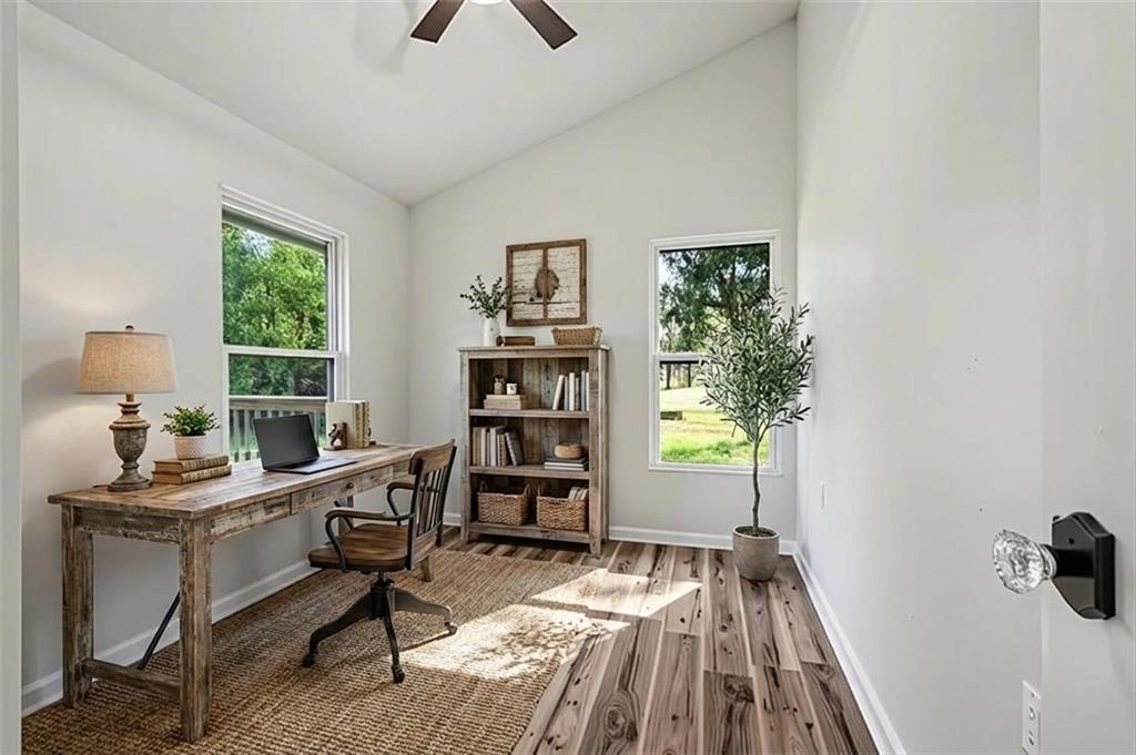 1004 Mapp Street Madison, GA 30650 - Photo 15 of 30 a view of a workspace with furniture and a window