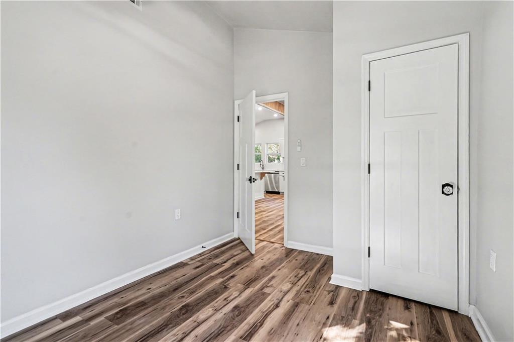 1004 Mapp Street Madison, GA 30650 - Photo 21 of 30 a view of a room with wooden floor and closet