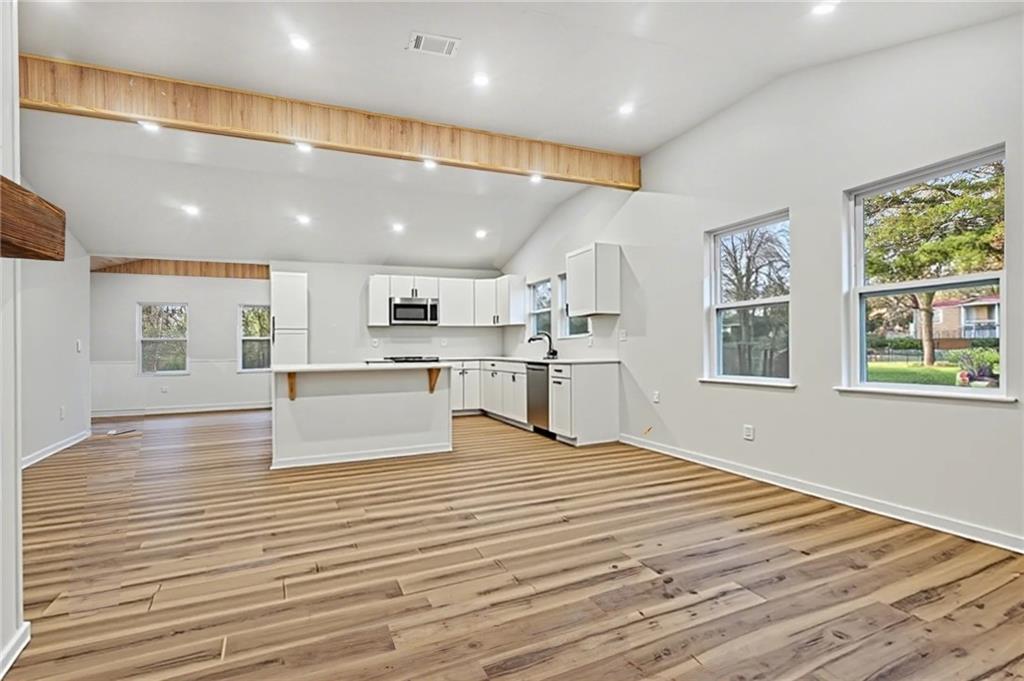 1004 Mapp Street Madison, GA 30650 - Photo 6 of 30 a view of kitchen with cabinets and wooden floor