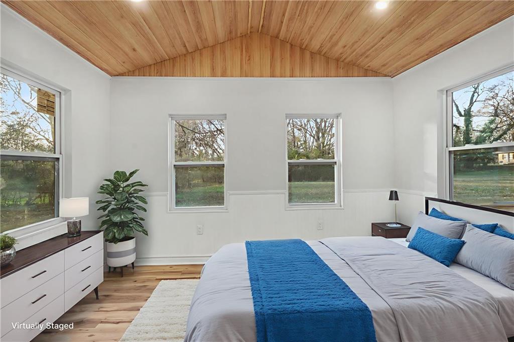 1004 Mapp Street Madison, GA 30650 - Photo 7 of 30 a bedroom with a large bed and a window