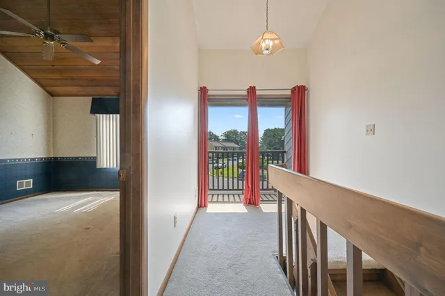 a view of a hallway view with staircase