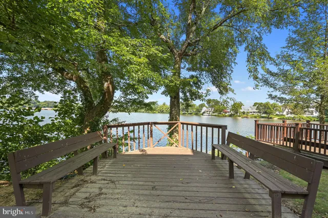 a view of balcony with wooden floor and outdoor seating
