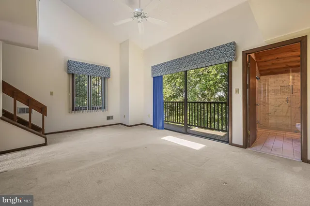 a view of a room with a large window