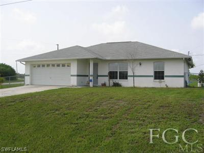 2010 Park Road Lehigh Acres, FL 33971 - Photo 1 of 9 a view of a house with backyard
