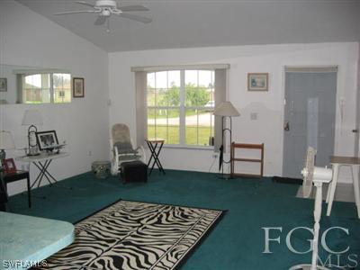 2010 Park Road Lehigh Acres, FL 33971 - Photo 3 of 9 a living room with furniture and a table