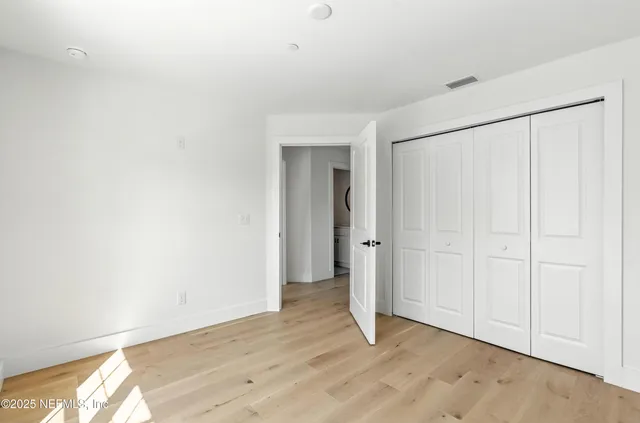 a bathroom with a sink toilet and a mirror