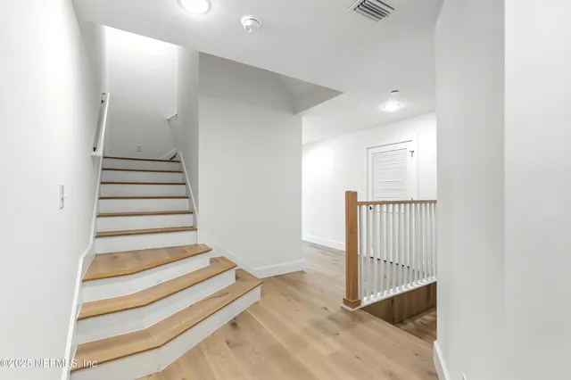 an empty room with wooden floor