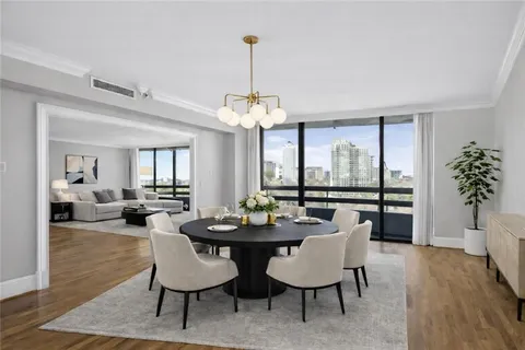 a view of a dining room with furniture window and wooden floor