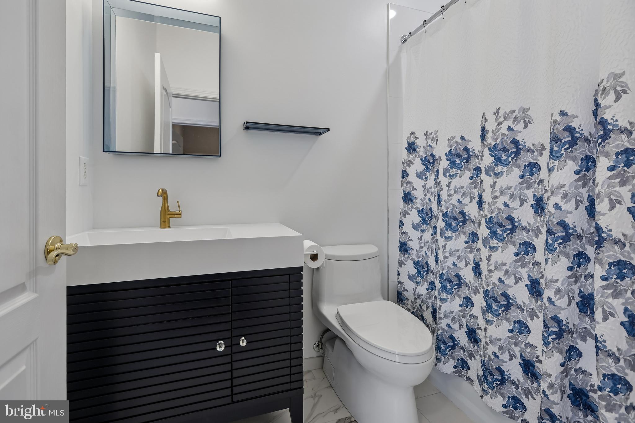 17 Pinflower Lane Princeton Junction, NJ 08550 - Photo 24 of 57 a bathroom with a sink a toilet and mirror