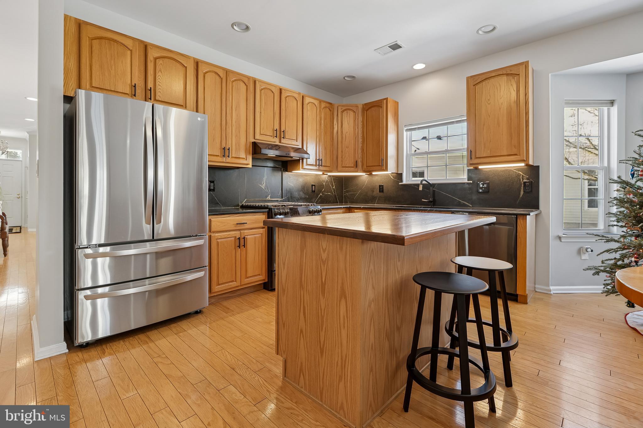17 Pinflower Lane Princeton Junction, NJ 08550 - Photo 4 of 57 a kitchen with stainless steel appliances granite countertop a refrigerator a stove a sink dishwasher and a microwave