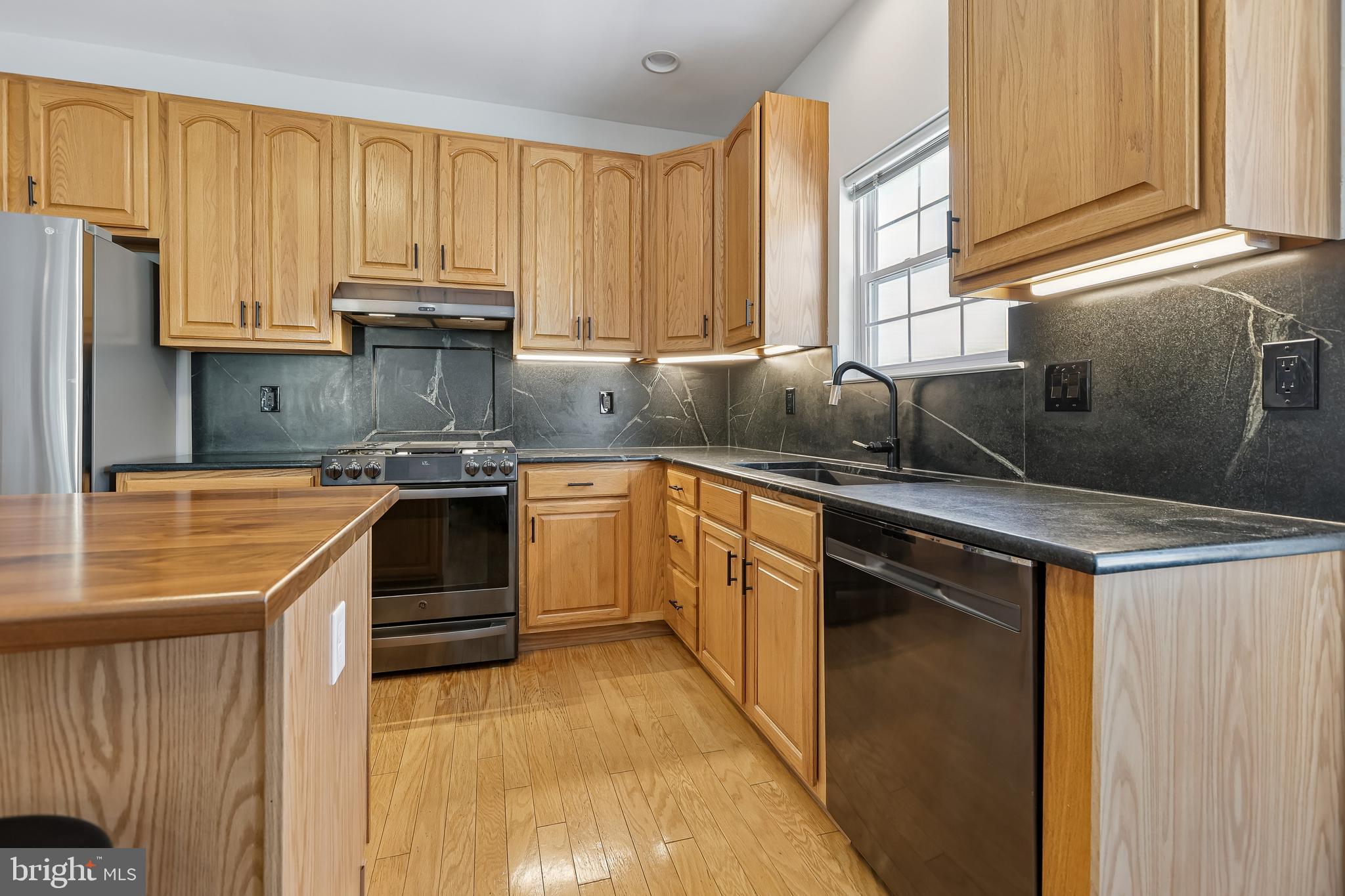 17 Pinflower Lane Princeton Junction, NJ 08550 - Photo 6 of 57 a kitchen with stainless steel appliances granite countertop a sink stove and refrigerator