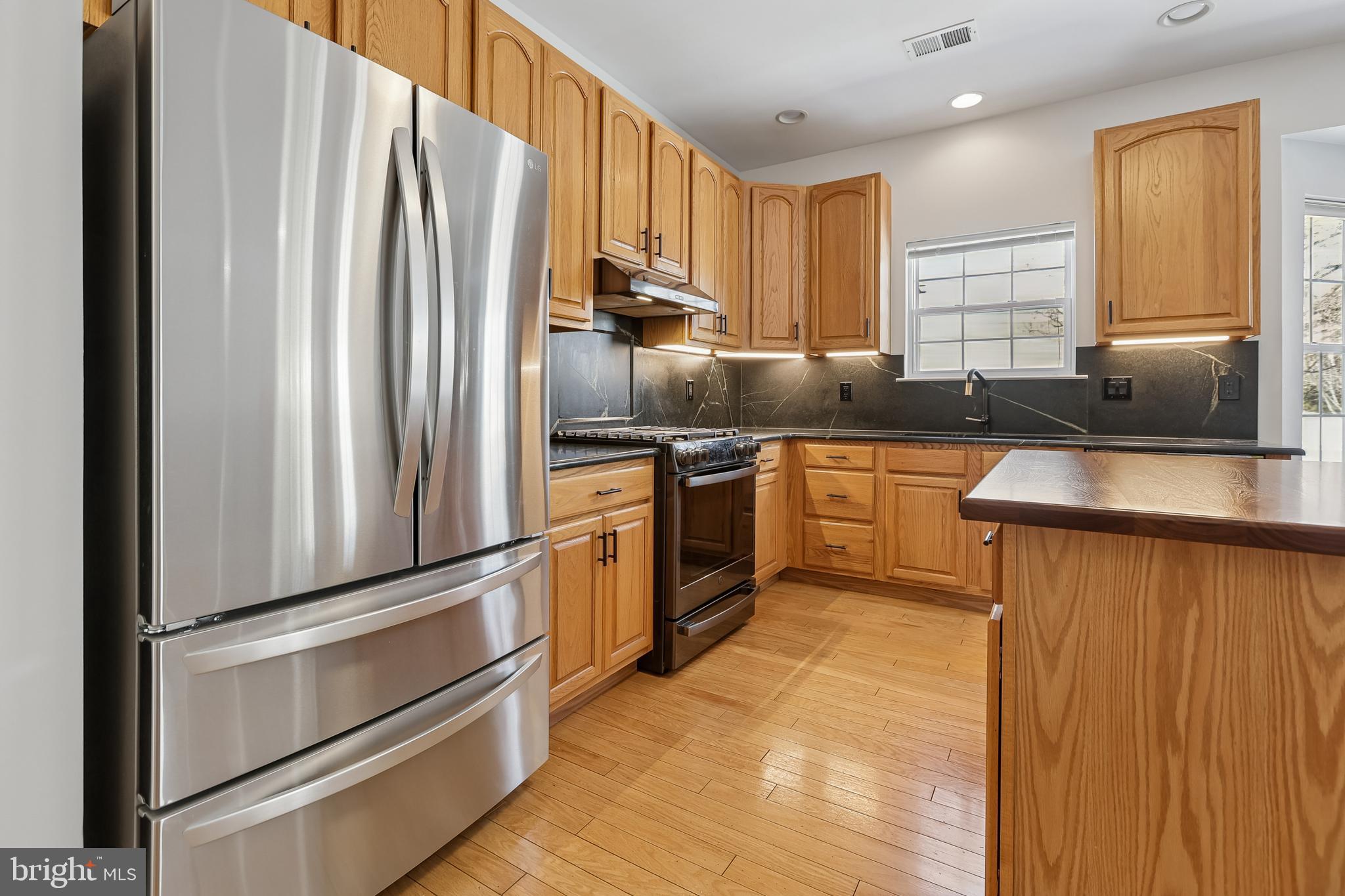 17 Pinflower Lane Princeton Junction, NJ 08550 - Photo 7 of 57 a kitchen with stainless steel appliances granite countertop a refrigerator sink and cabinets