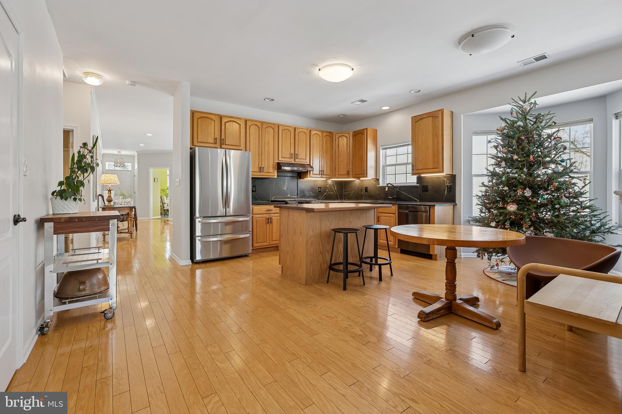 17 Pinflower Lane Princeton Junction, NJ 08550 - Photo 10 of 57 a open kitchen with stainless steel appliances granite countertop a refrigerator and a stove top oven