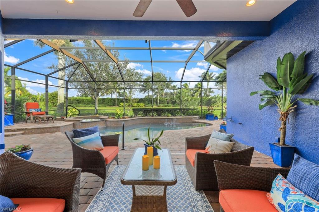 7688 Cottesmore Drive Naples, FL 34113 - Photo 30 of 45 a living room with patio furniture and a potted plants