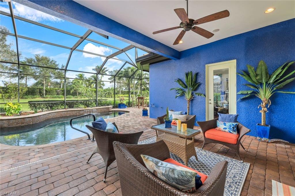 7688 Cottesmore Drive Naples, FL 34113 - Photo 31 of 45 a living room with furniture and a large window