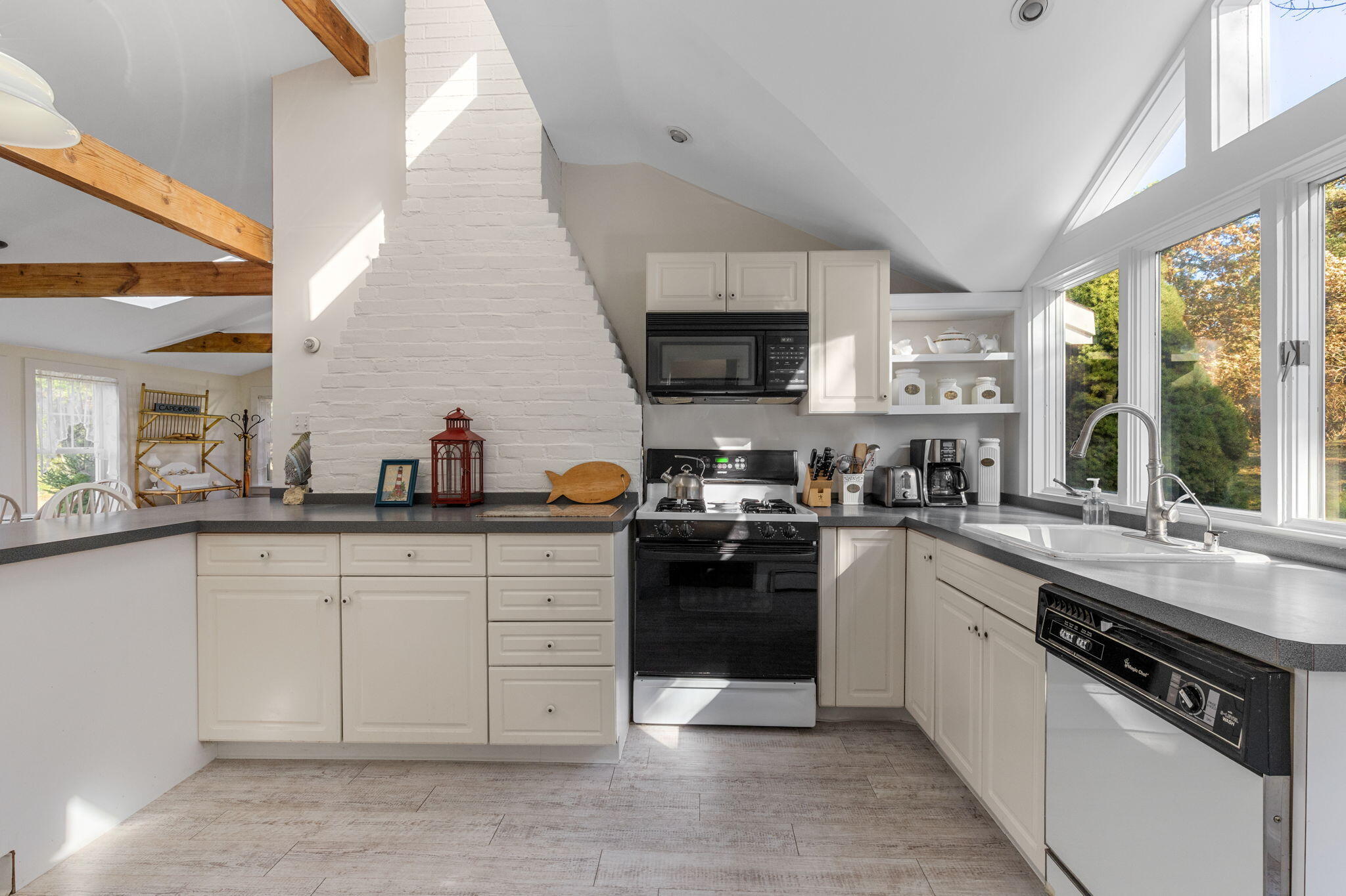 6 Cora Nickerson Road Harwich, MA 02645 - Photo 13 of 42 a kitchen with stainless steel appliances granite countertop a stove sink and cabinets