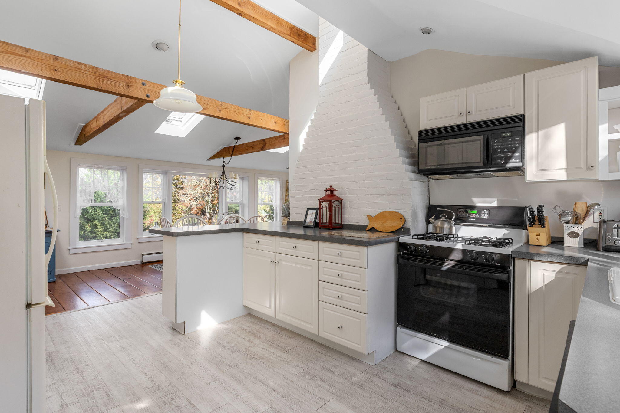 6 Cora Nickerson Road Harwich, MA 02645 - Photo 14 of 42 a kitchen with stainless steel appliances granite countertop a sink a stove and a refrigerator