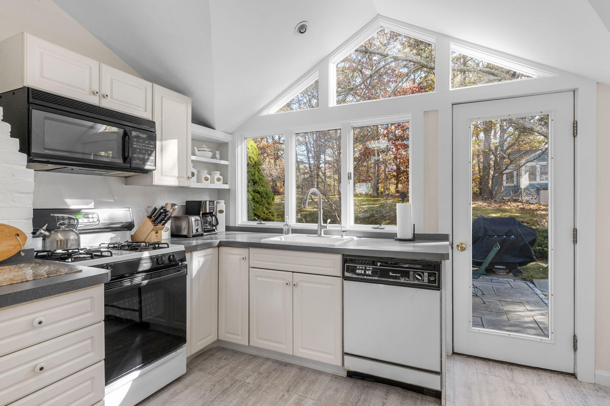 6 Cora Nickerson Road Harwich, MA 02645 - Photo 15 of 42 a kitchen with stainless steel appliances granite countertop a stove and a sink