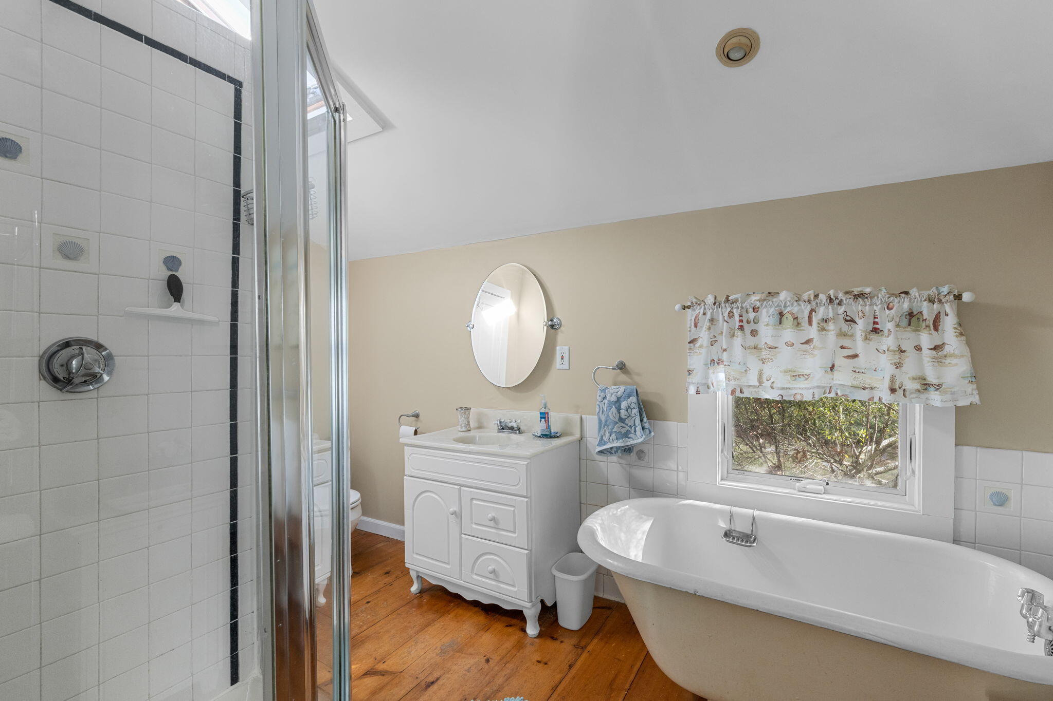 6 Cora Nickerson Road Harwich, MA 02645 - Photo 16 of 42 a bathroom with a tub a sink and a large mirror