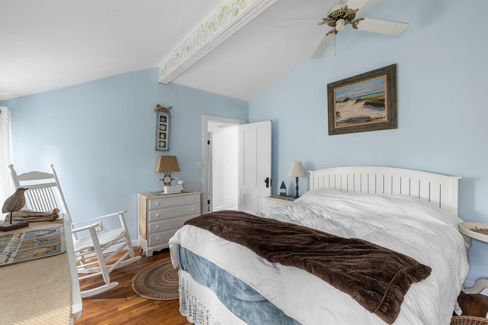 6 Cora Nickerson Road Harwich, MA 02645 - Photo 19 of 42 a bedroom with a bed and a table in it