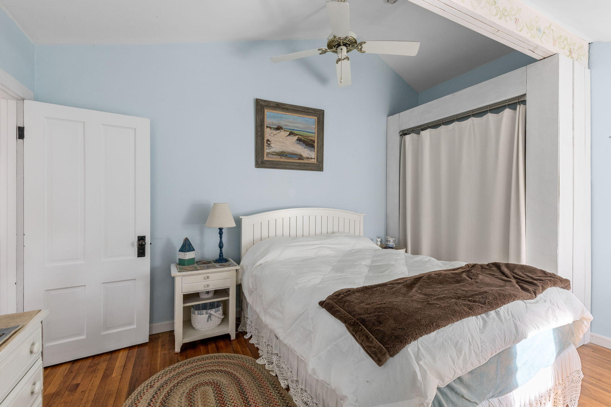 6 Cora Nickerson Road Harwich, MA 02645 - Photo 20 of 42 a bedroom with a bed and a chandelier