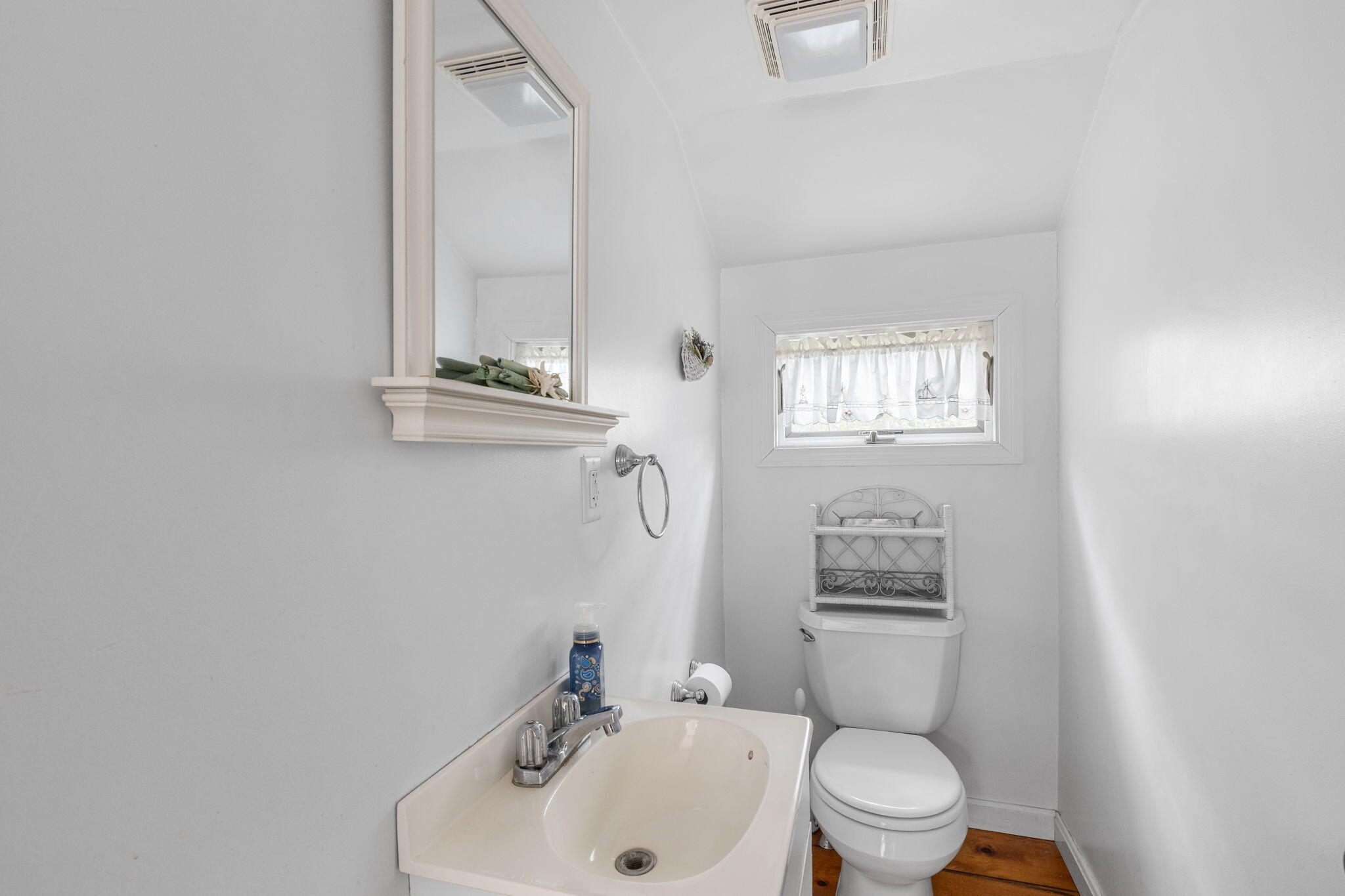 6 Cora Nickerson Road Harwich, MA 02645 - Photo 21 of 42 a bathroom with a toilet a sink and mirror