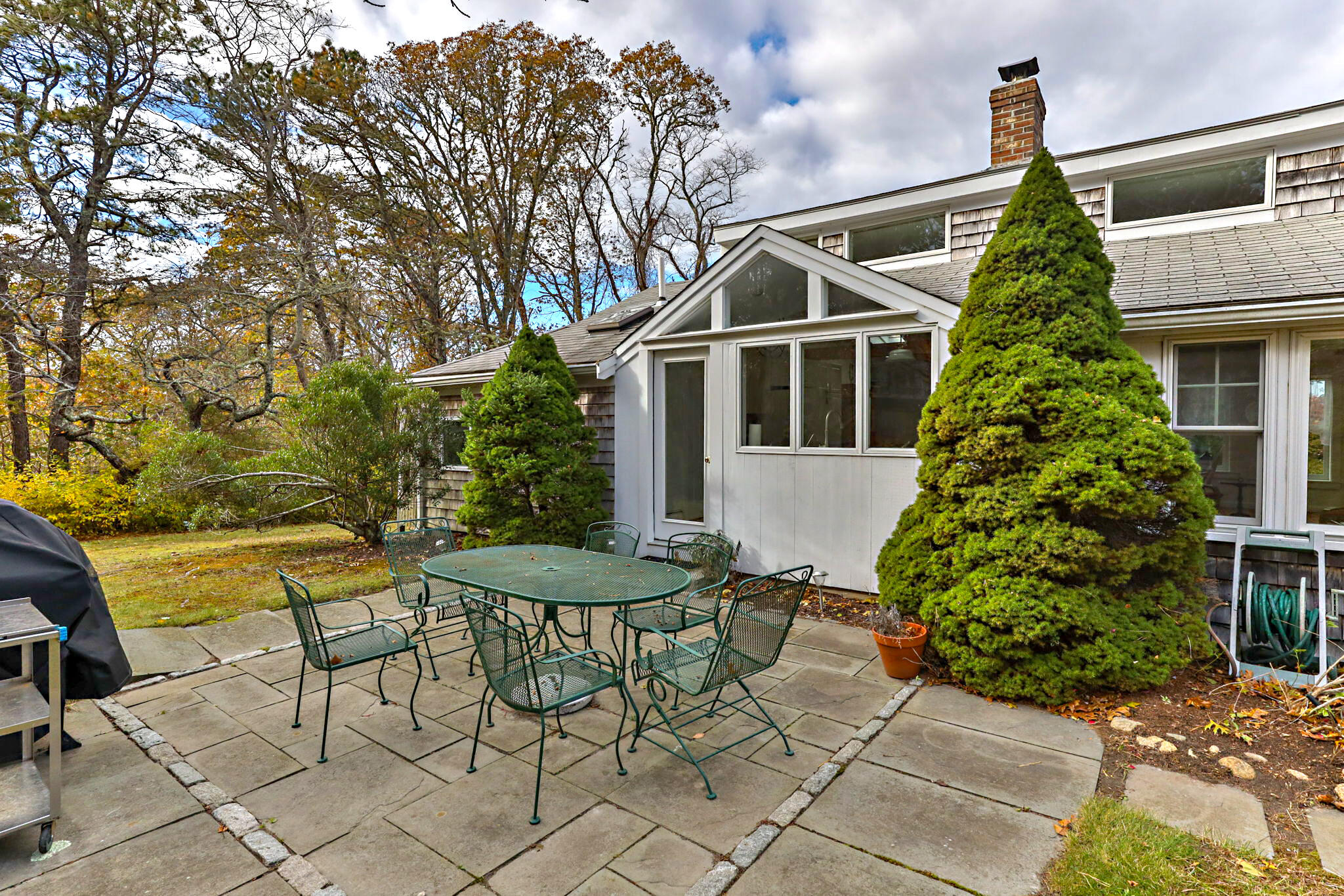 6 Cora Nickerson Road Harwich, MA 02645 - Photo 33 of 42 a view of a house with backyard and sitting area