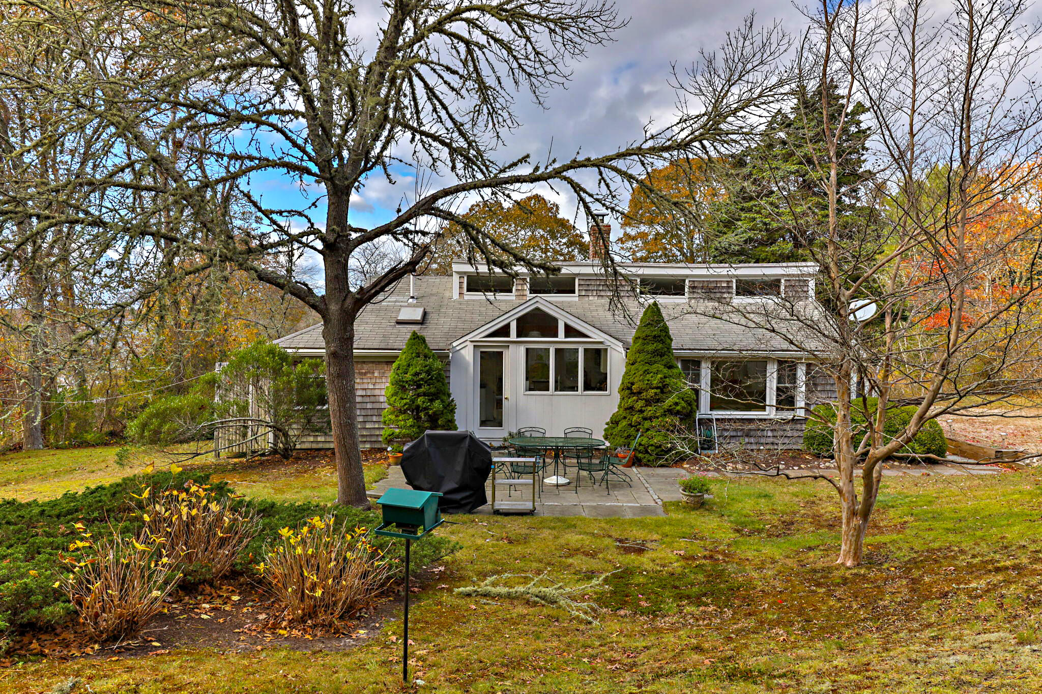 6 Cora Nickerson Road Harwich, MA 02645 - Photo 34 of 42 a house with trees in front of it
