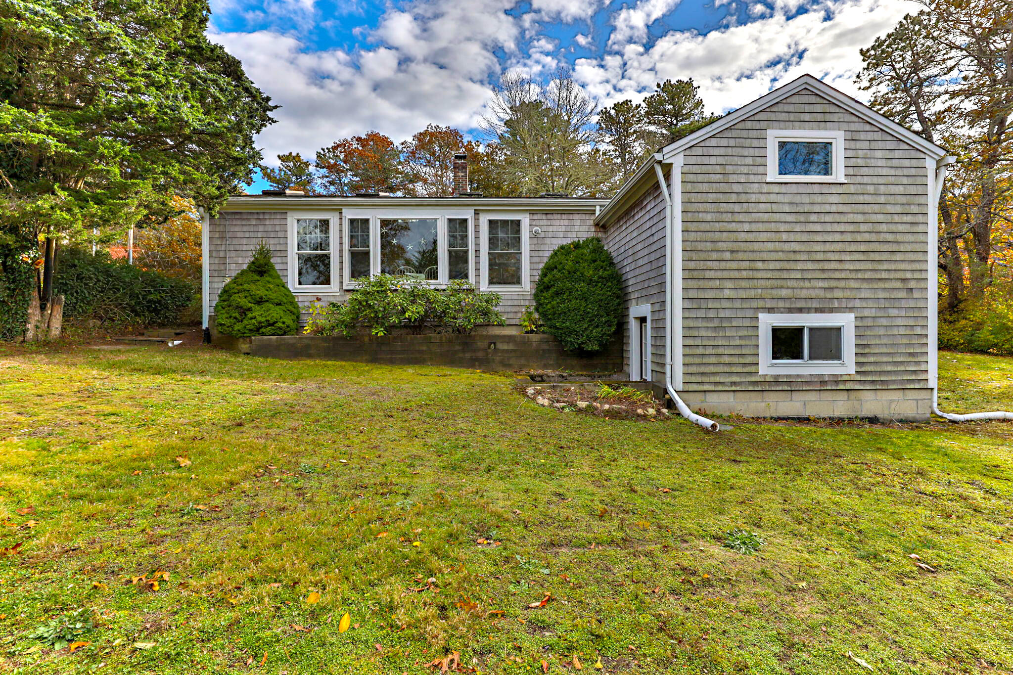 6 Cora Nickerson Road Harwich, MA 02645 - Photo 37 of 42 a view of a house with a yard and sitting area