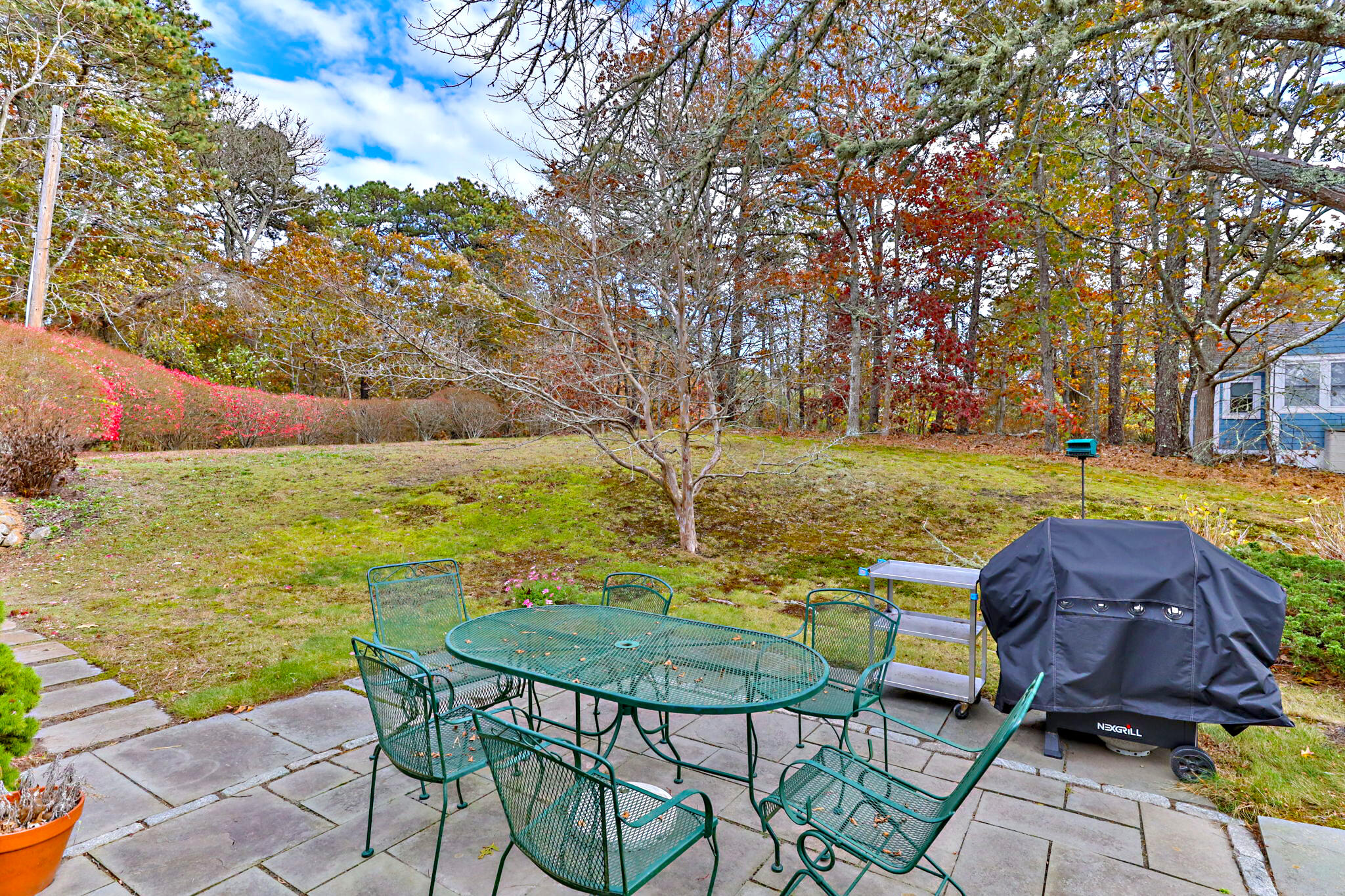 6 Cora Nickerson Road Harwich, MA 02645 - Photo 41 of 42 a view of a swimming pool with an outdoor seating space
