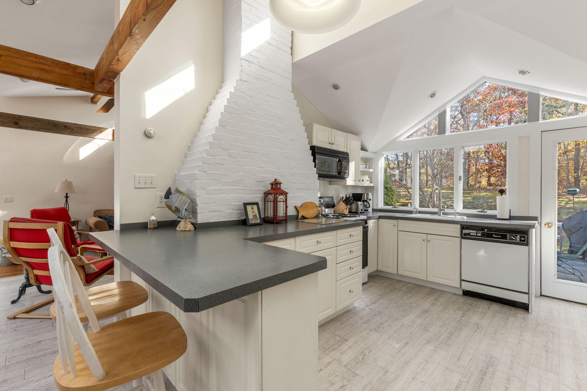 6 Cora Nickerson Road Harwich, MA 02645 - Photo 5 of 42 a kitchen with stainless steel appliances granite countertop a sink dishwasher and cabinets with wooden floor