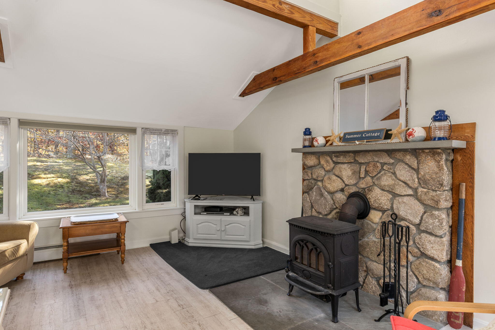 6 Cora Nickerson Road Harwich, MA 02645 - Photo 9 of 42 a living room with furniture and a flat screen tv