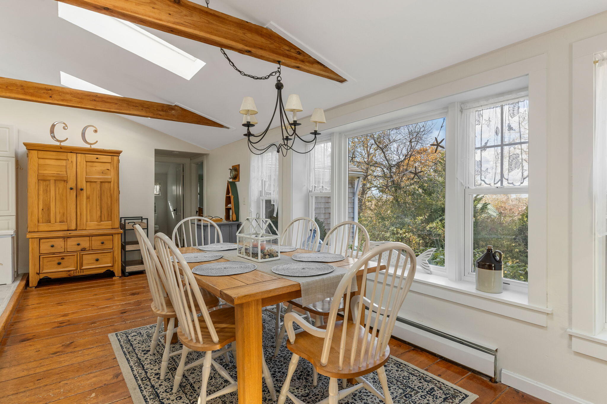 6 Cora Nickerson Road Harwich, MA 02645 - Photo 10 of 42 a view of a dining room with furniture window and wooden floor