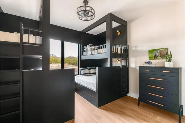 a kitchen with a refrigerator and a stove