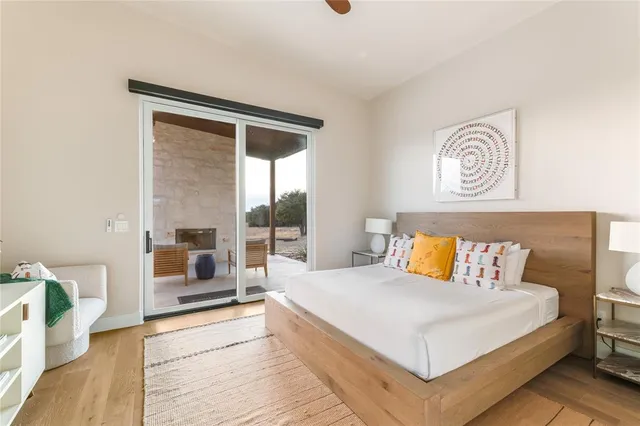 a bedroom with a bed and a large window