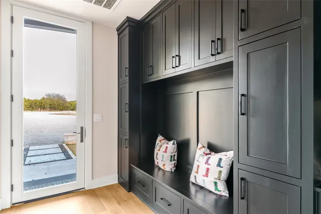 a view of an entryway with wooden floor