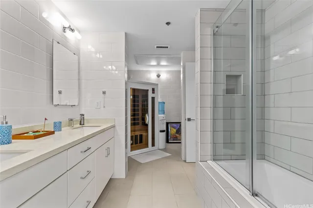 a bathroom with a shower sink and mirror