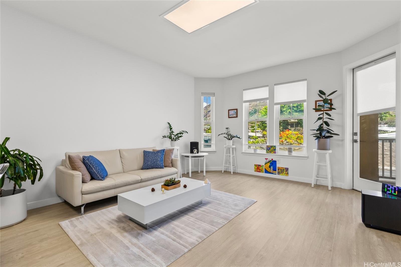 520 Lunalilo Home Road, Unit 8107 Honolulu, HI 96825 - Photo 6 of 25 a living room with furniture and wooden floor