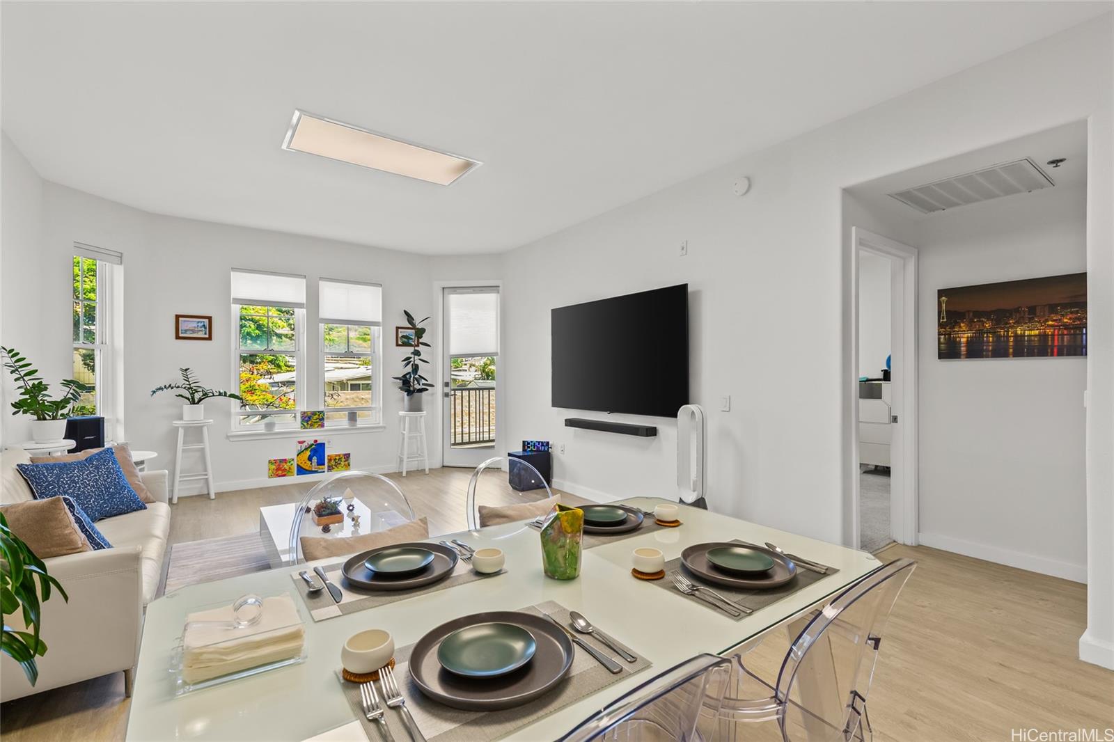 520 Lunalilo Home Road, Unit 8107 Honolulu, HI 96825 - Photo 8 of 25 a living room with furniture and a flat screen tv